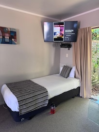 X2. single Beds in lounge
Has 2 wicker seats
Small Dining table w 4 Seats
Full kitchen w bar fridge