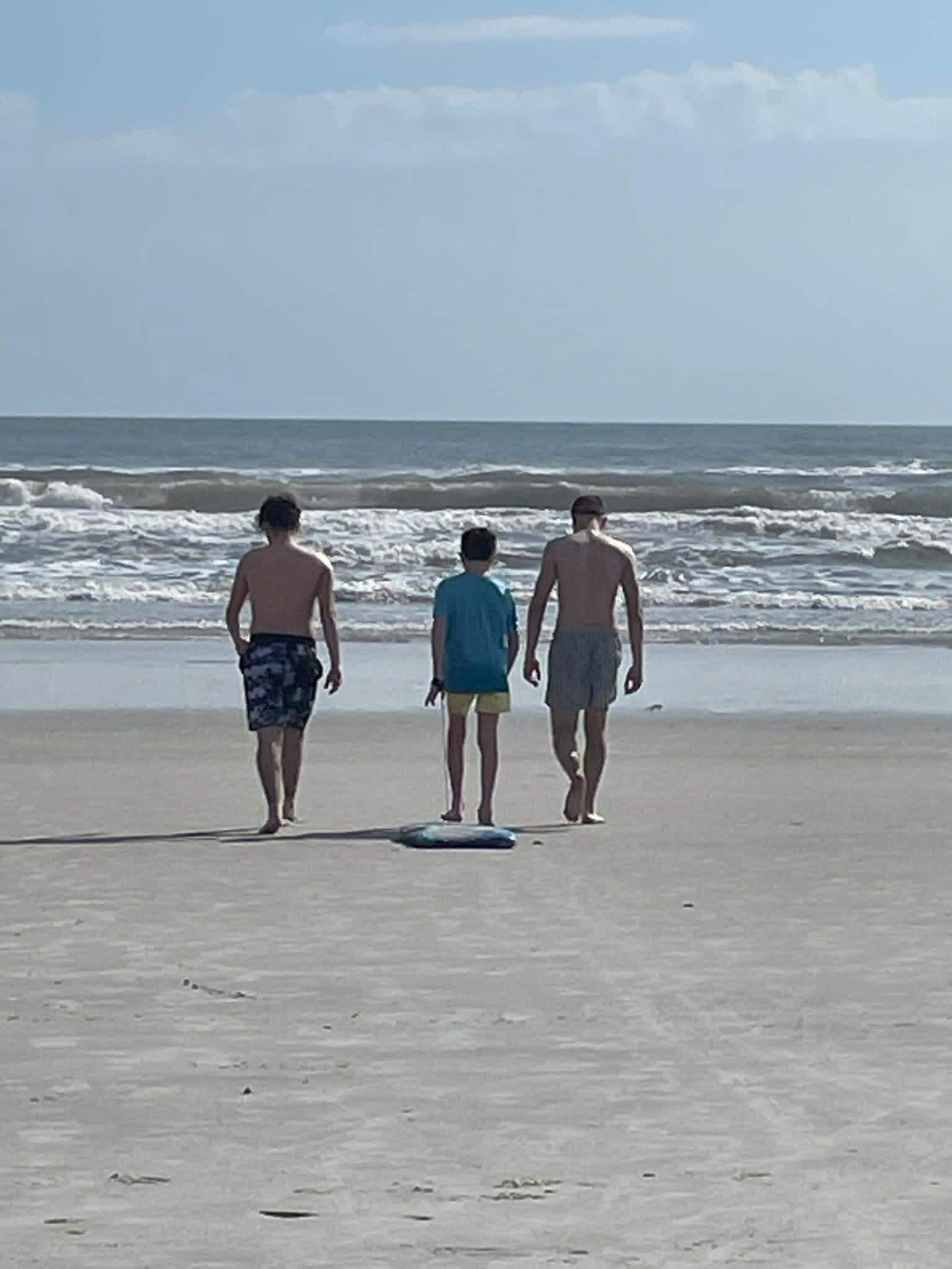 The grandsons enjoying the beach. 