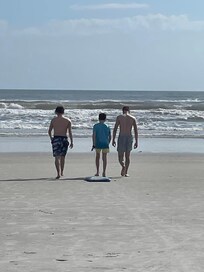 The grandsons enjoying the beach.