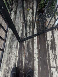 Hard to see, but there's a visible scratch mark where the door drags. You have to use some force to open it!