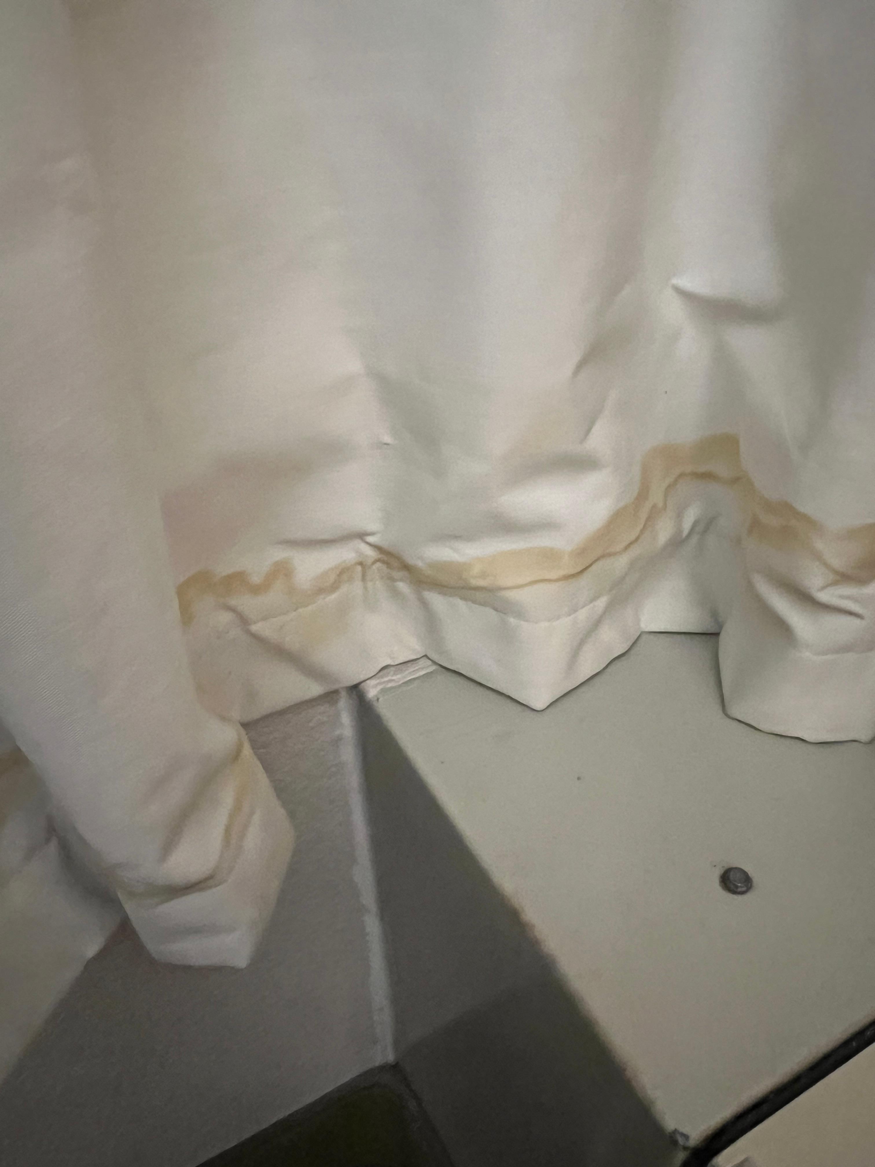 Black out curtains had yellow staining looking like urine on bottom. 