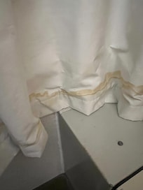 Black out curtains had yellow staining looking like urine on bottom.