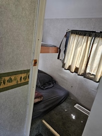 Two of the beds that would only sleep a toddler. You cannot walk into this space.