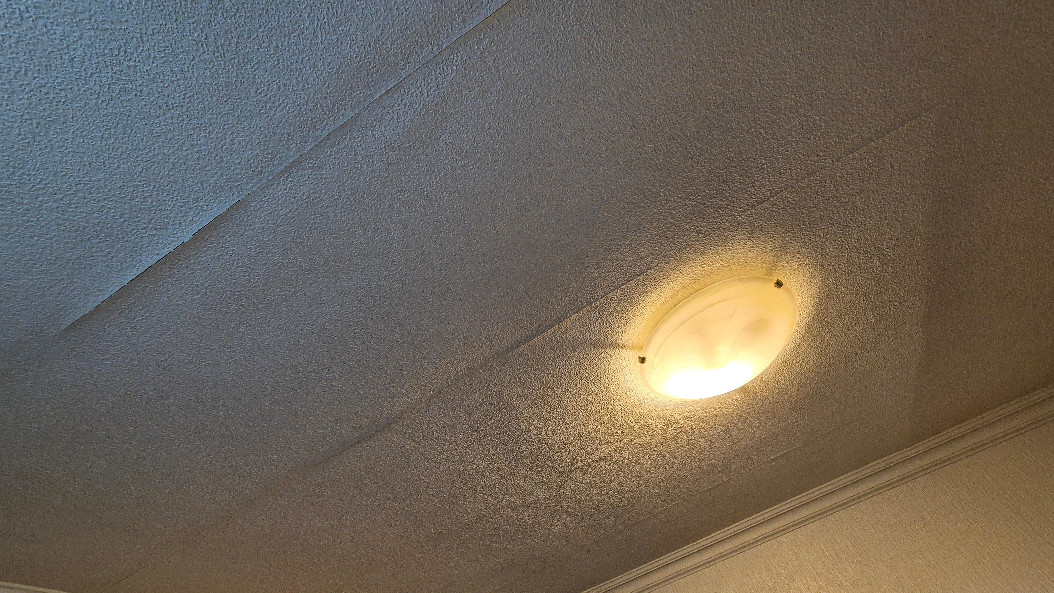 Wallpaper peeling off the ceiling