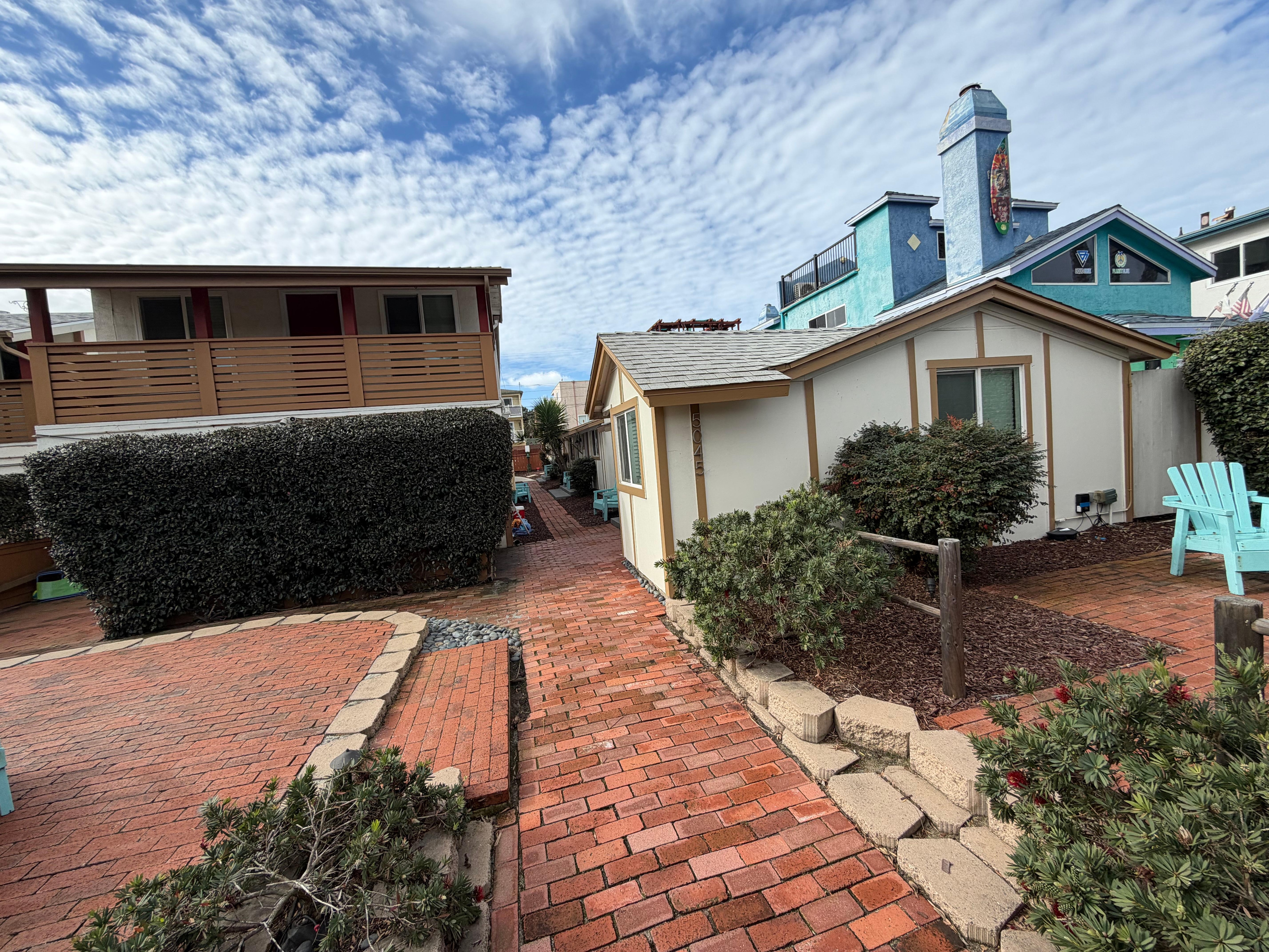 Pathway and courtyard/patio, with the location on the right. 