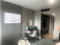 TV area along with tea and coffee making facilities and clothes hanging space