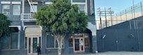 Woman was asking for money, talking to herself. Building looked like it was abandoned.