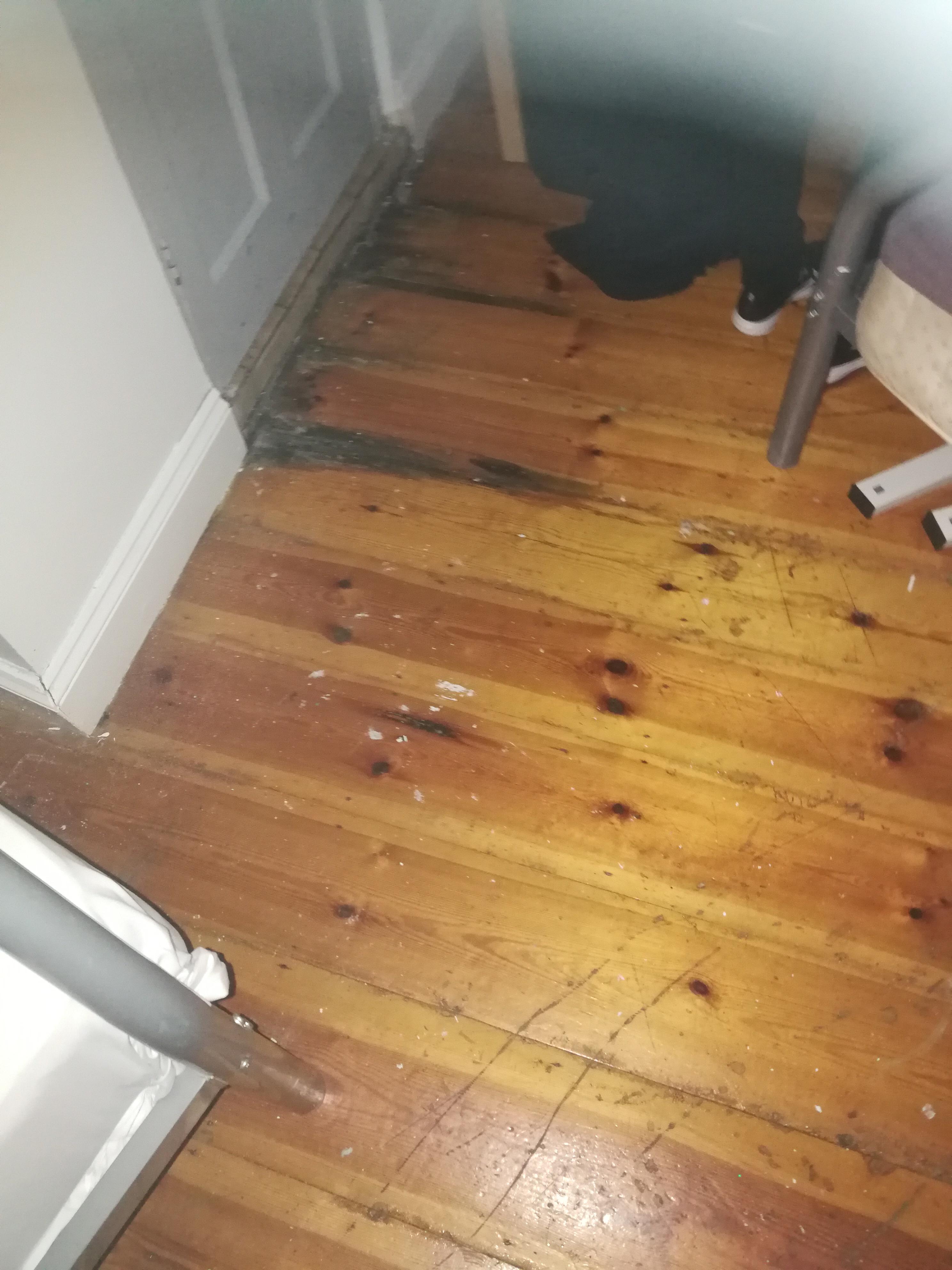 Paint and dirt on wooden floors