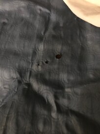 Cigarette burn holes bedspread