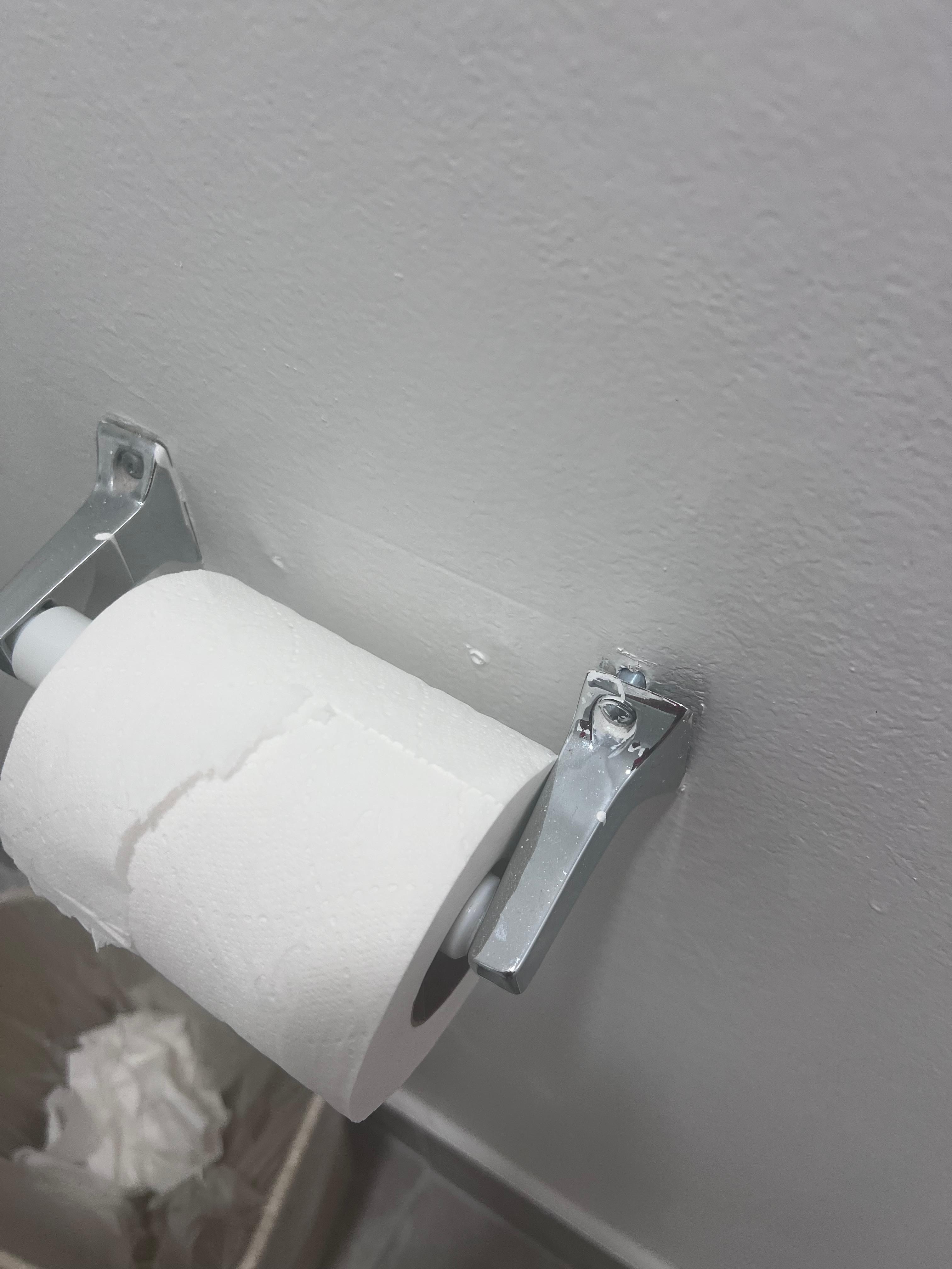 The toilet paper holder was broken.