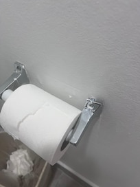 The toilet paper holder was broken.