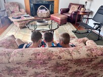 3 boys playing video games together in the living room!