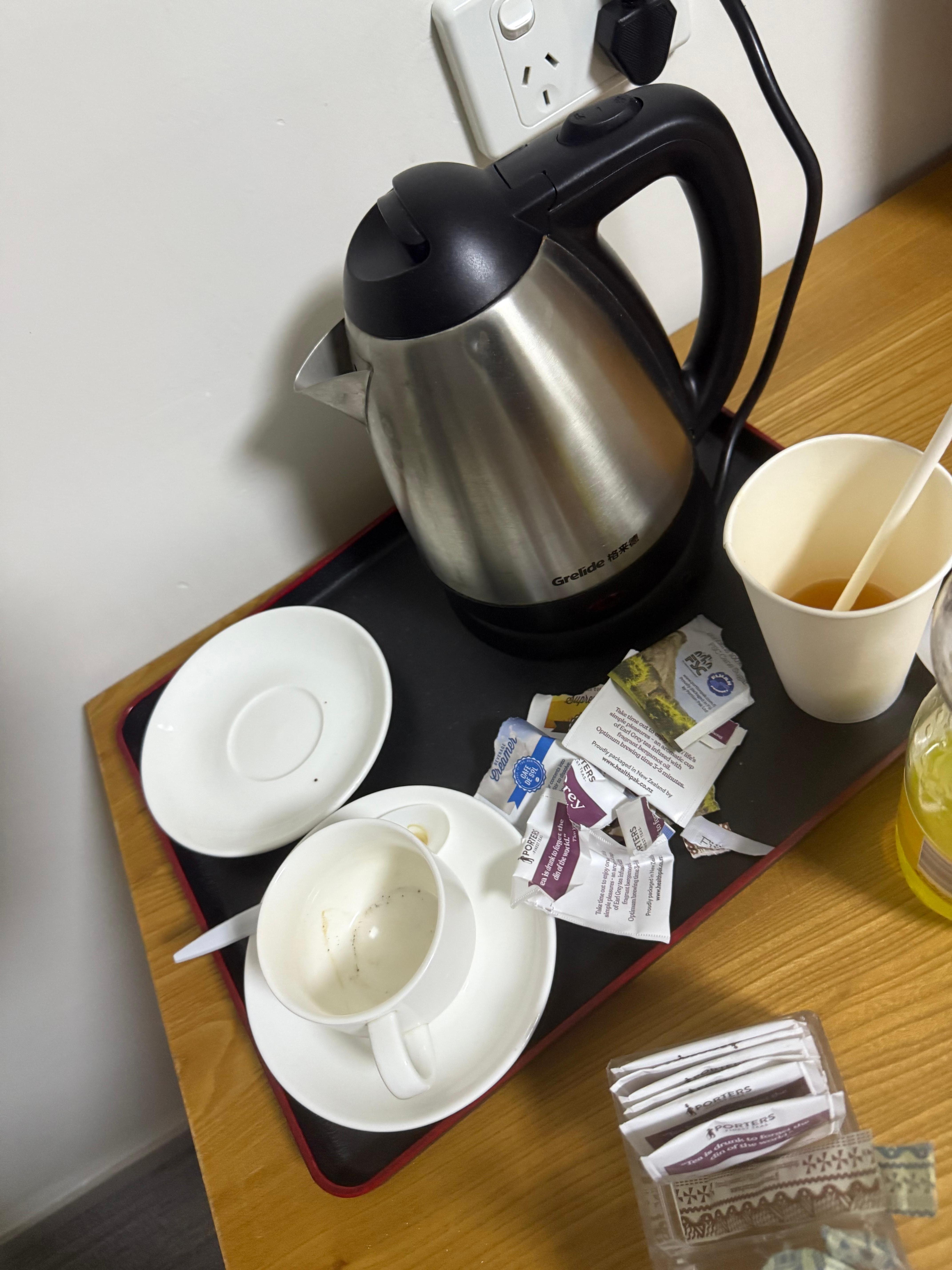 Picture of dirty cups still left on second day on my stay after my room was cleaned.