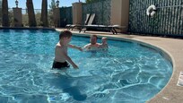Playing in the pool where it was nice and cool