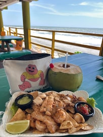 The delicious food at the restaurant right by the ocean