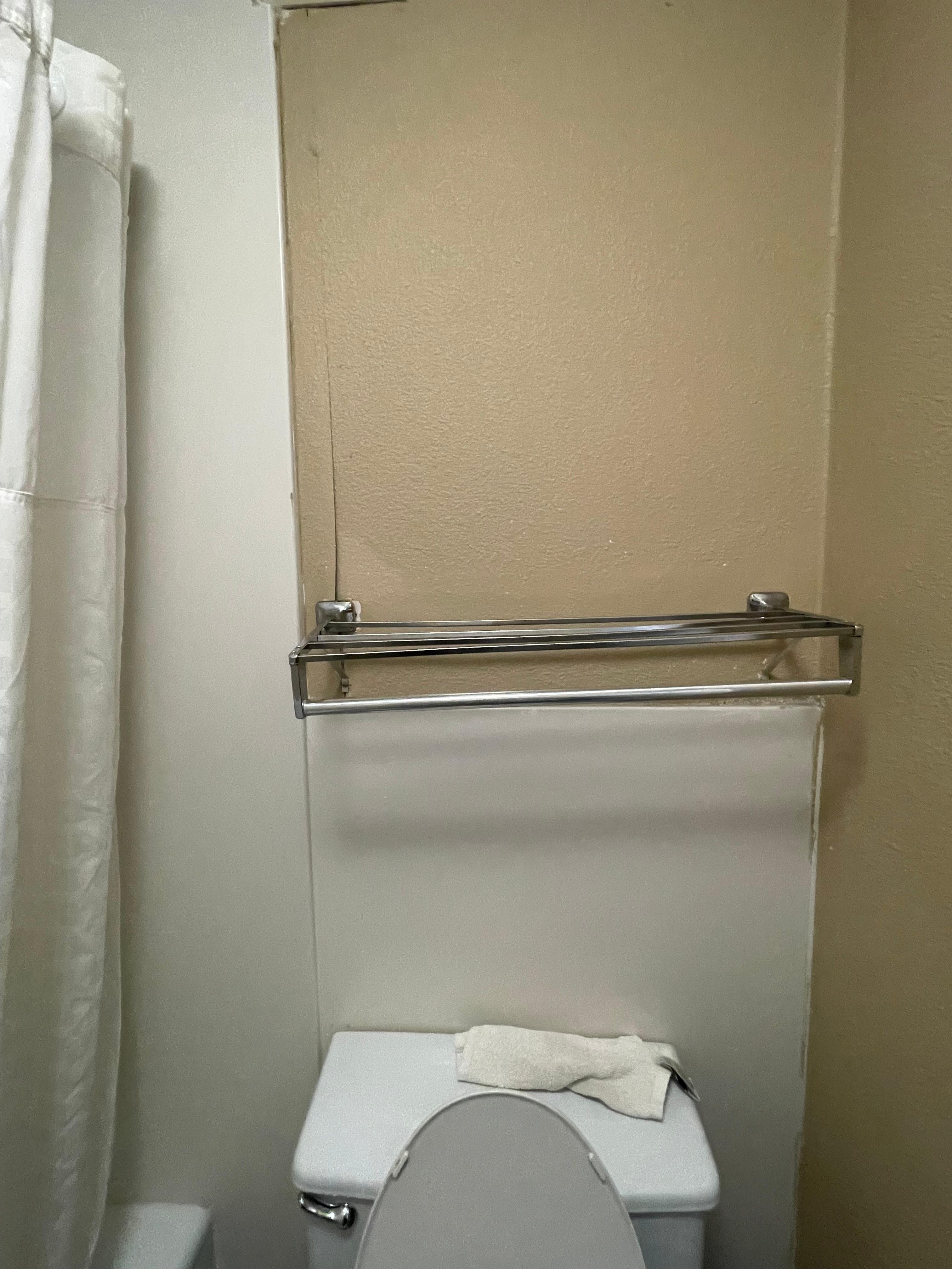 Towel rack coming off the wall 