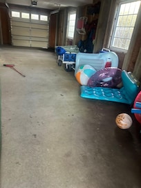 Garage area where the bedroom with two queens are located