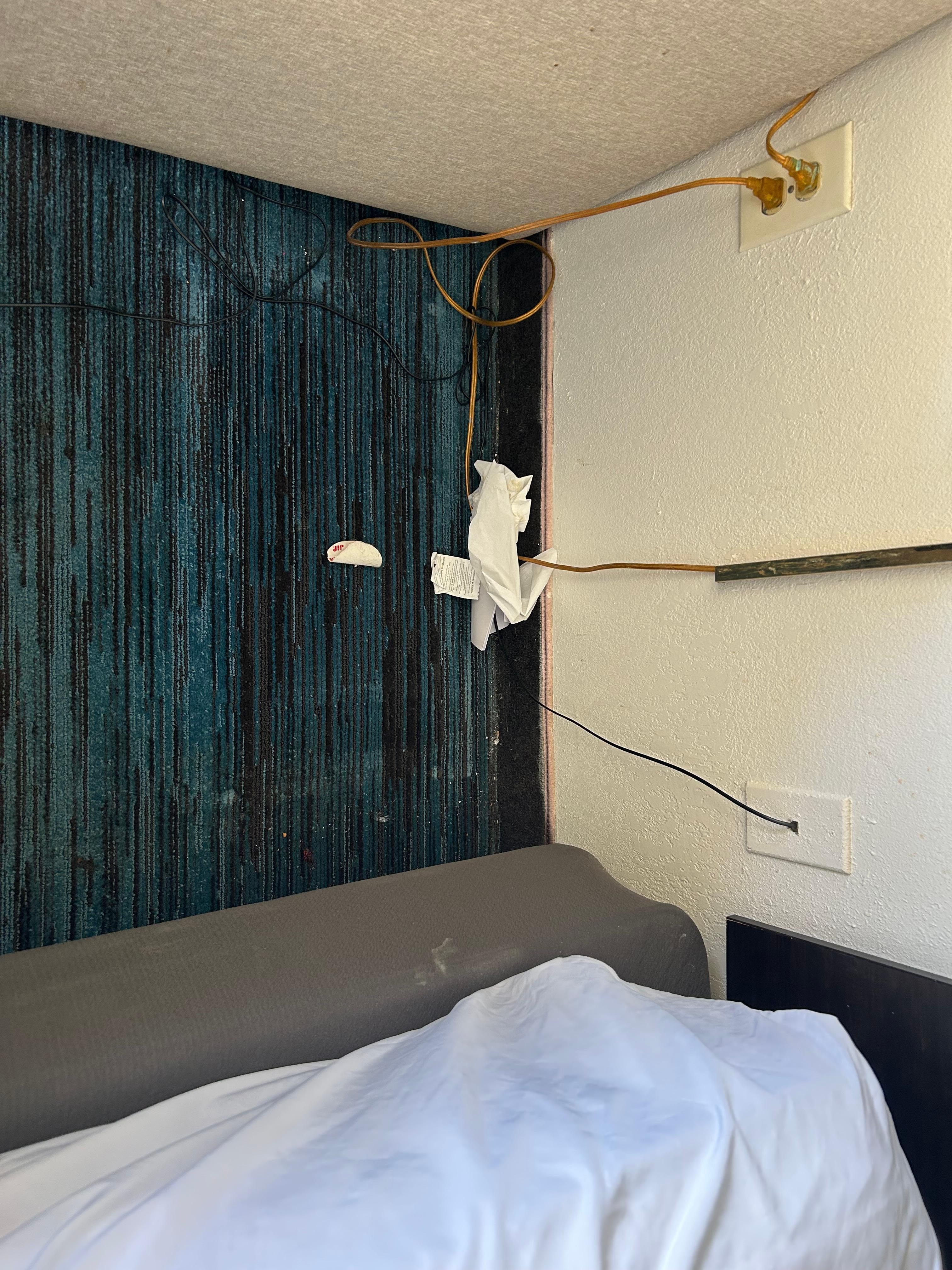 Behind the night stand in the second room