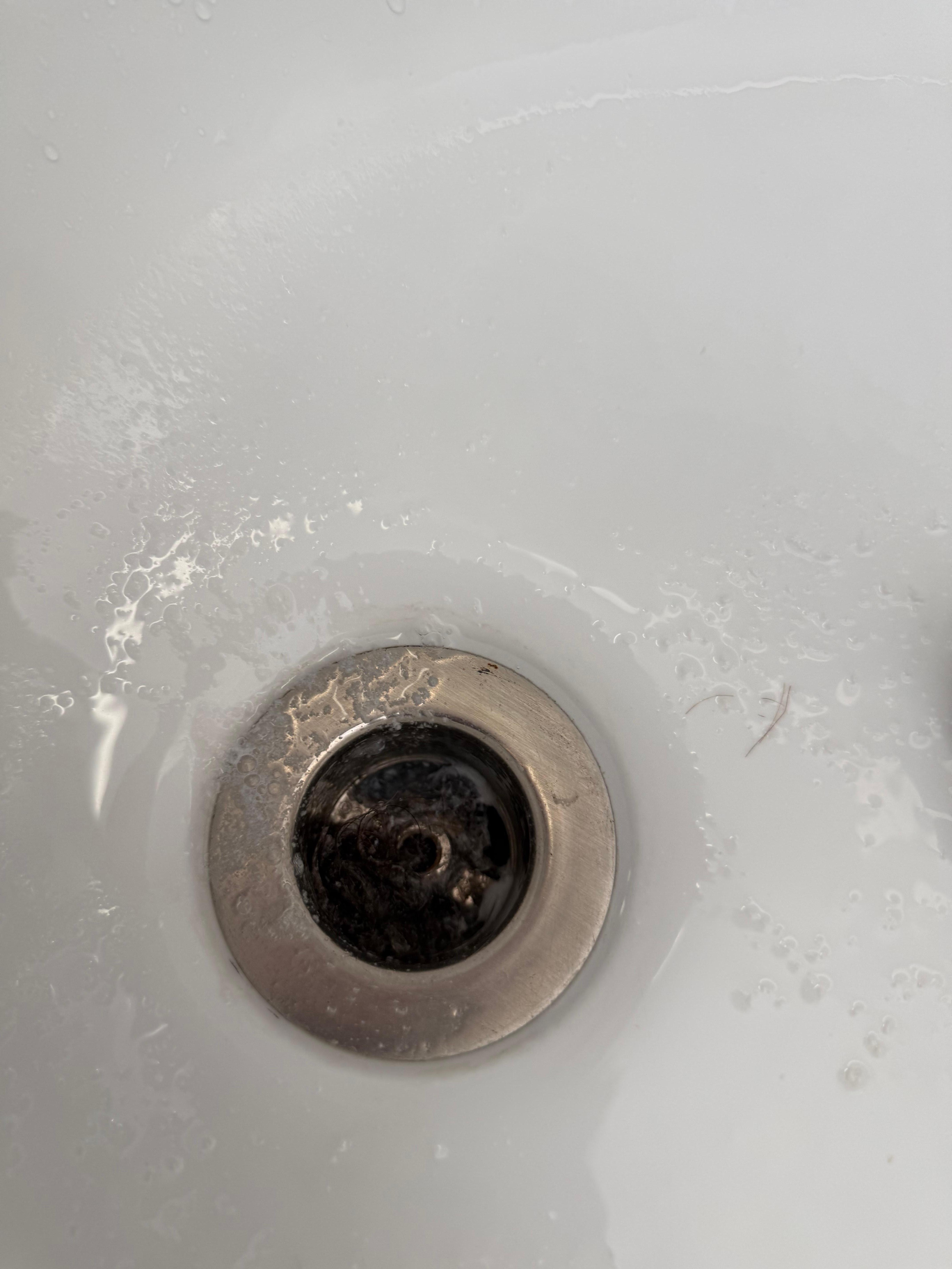 Nasty clogged hair and gunk in tub upstairs master