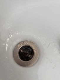 Nasty clogged hair and gunk in tub upstairs master