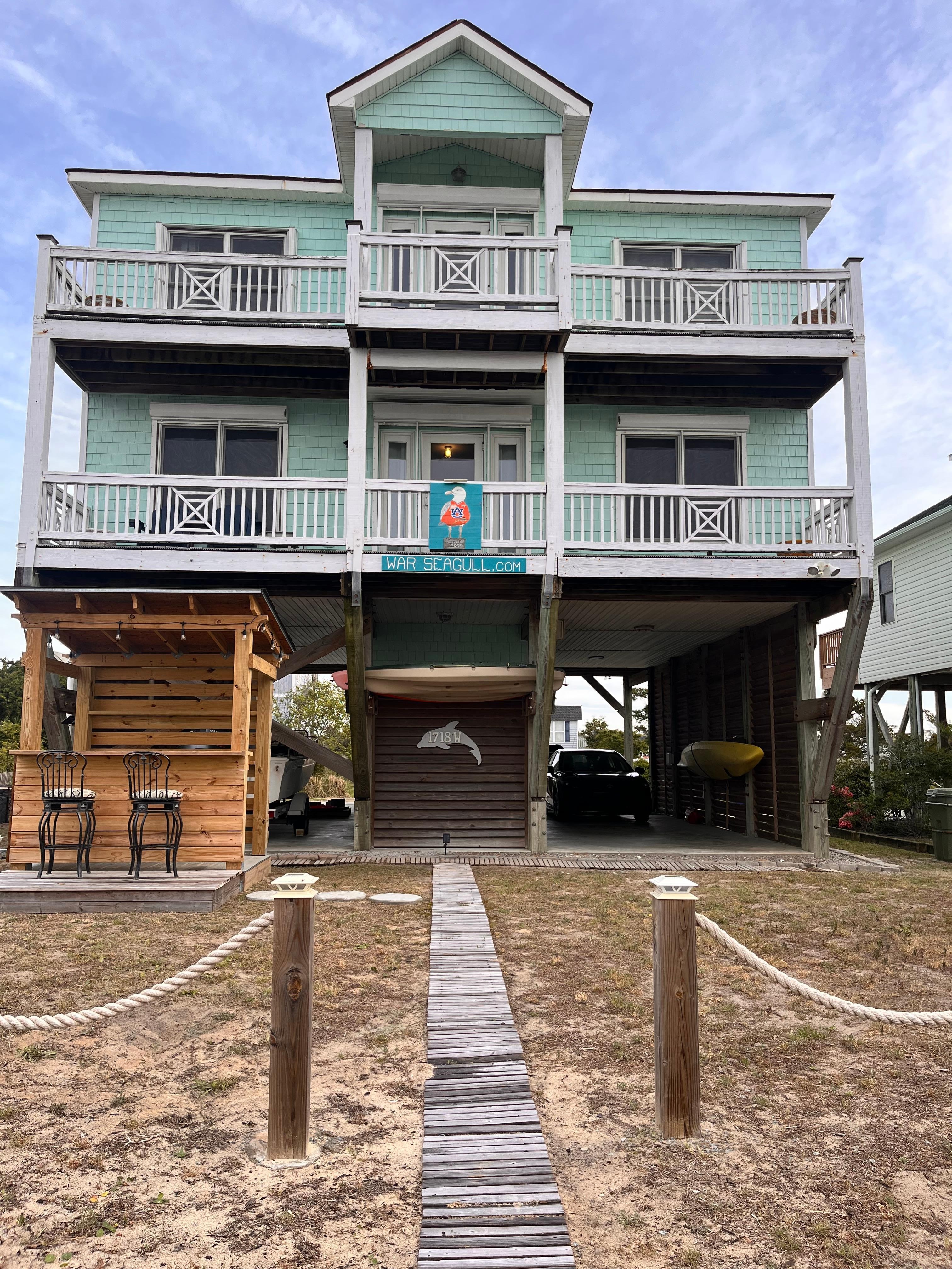 This house is stunning! Has a cute little tiki bar in the front with a fire pit. We bought wood but noticed there is wood already there for you.  