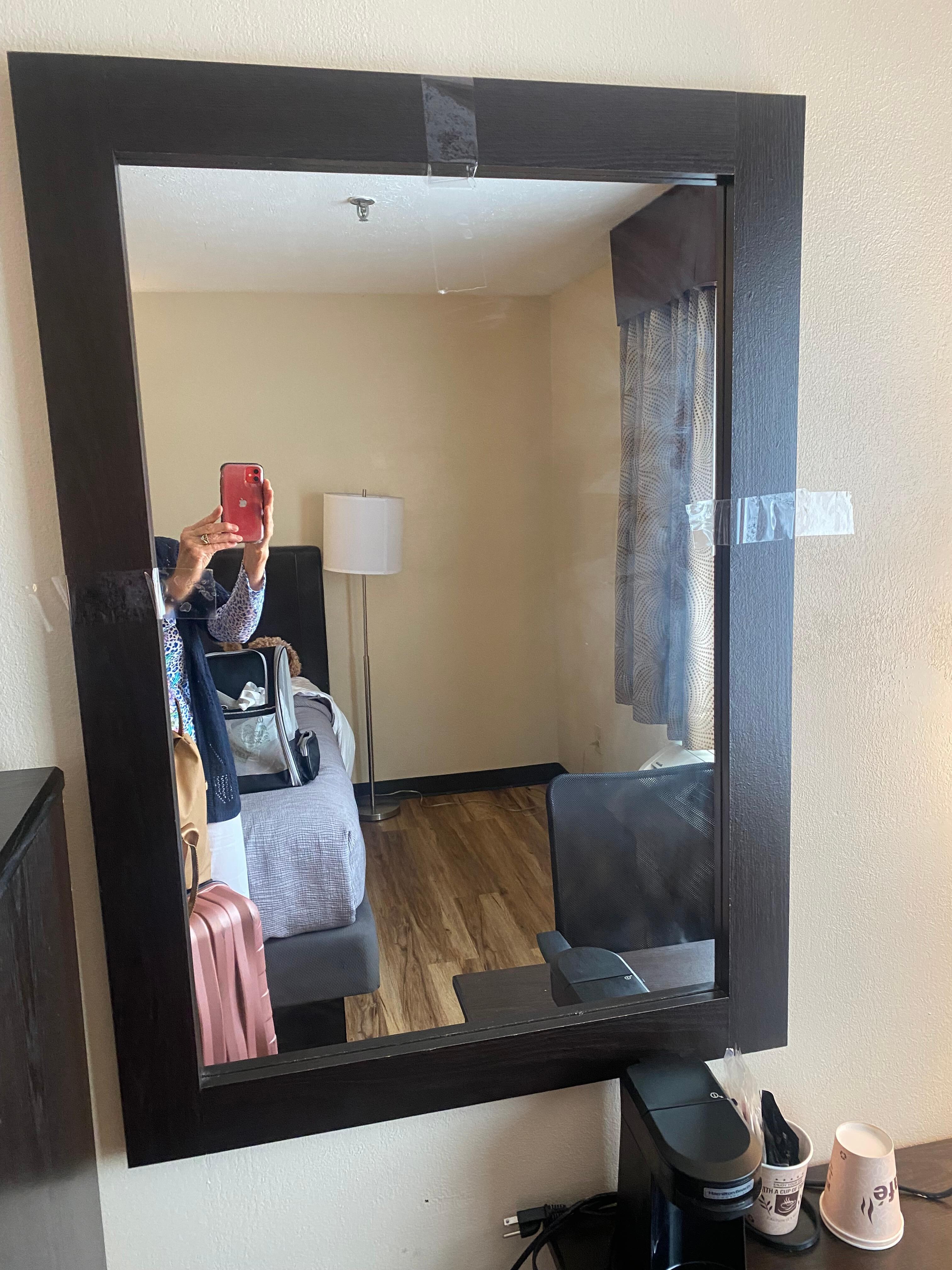 Glass in the mirror secured by tape