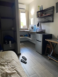 Fairly clean at check in but had to buy own water. No hot water. Sometimes warm-ish water. Room stunk at check in. Didn’t use any appliances so don’t know if they worked. AC and TV worked. Ceiling fan noisy.