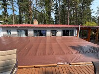 Tarp temporary roofing blocked indoor views of lake. Made for very dark inside.