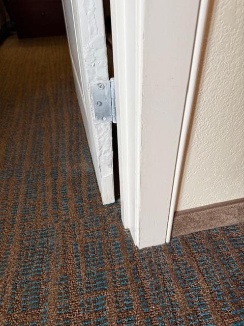 Unsighly door jam repair job.