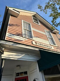 The upper unit/windows are the condo and the pink siding was being replaced.