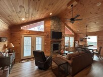 Beautiful living room with plenty of natural light during the day & recessed lighting in the evening.