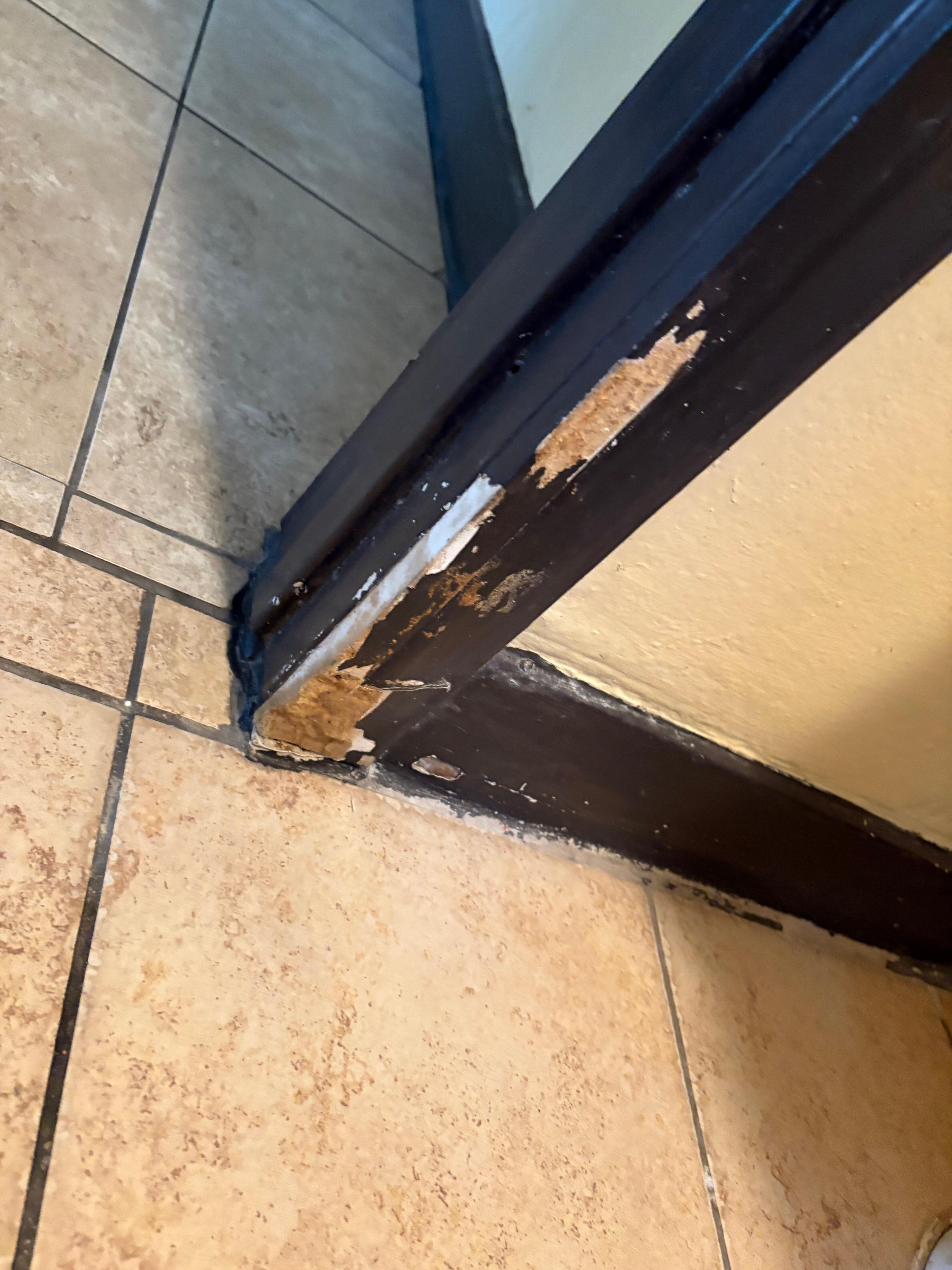 Broken door and hinges.