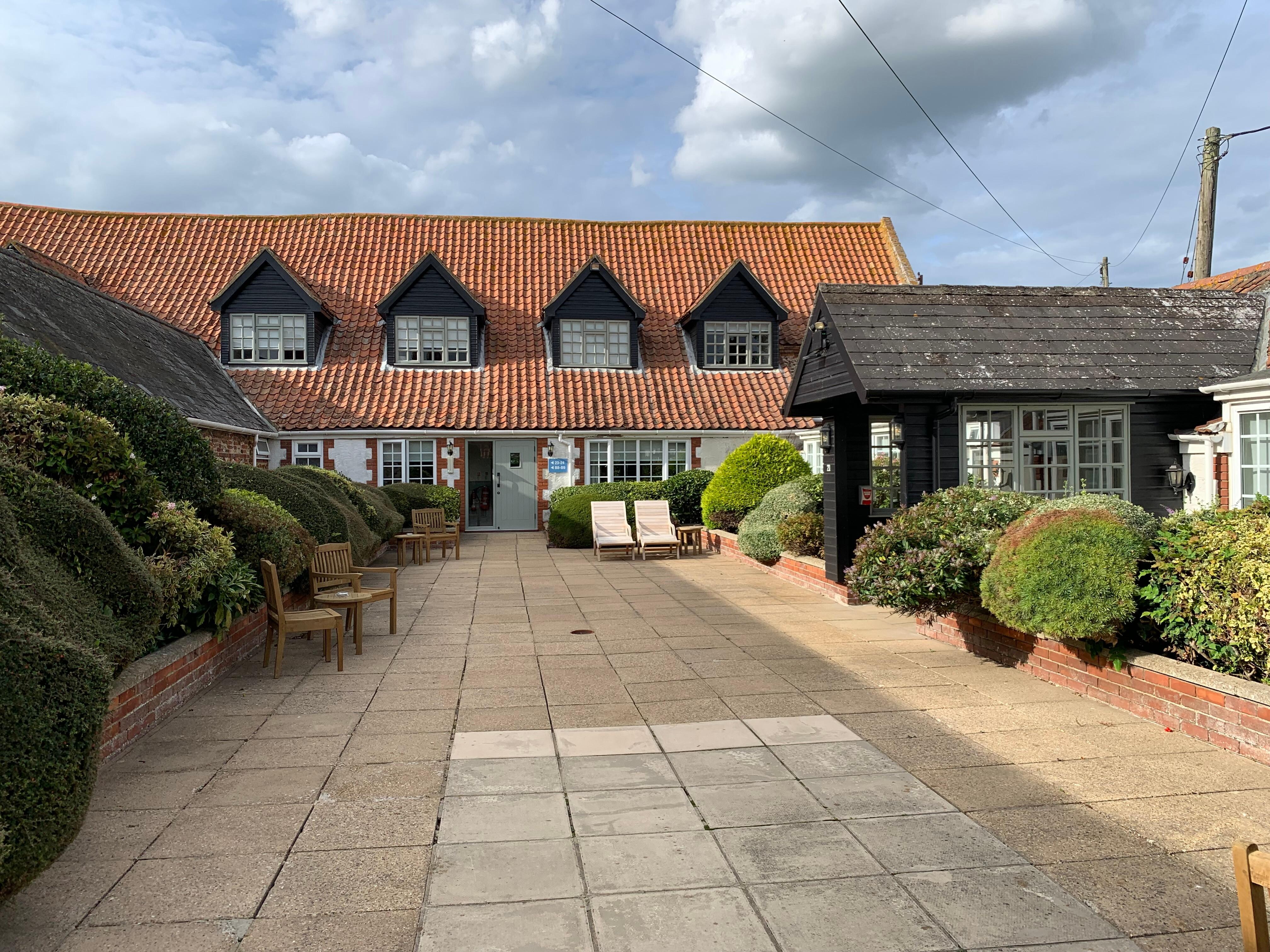 Seating area outside the room for a glass of wine on a summer evening