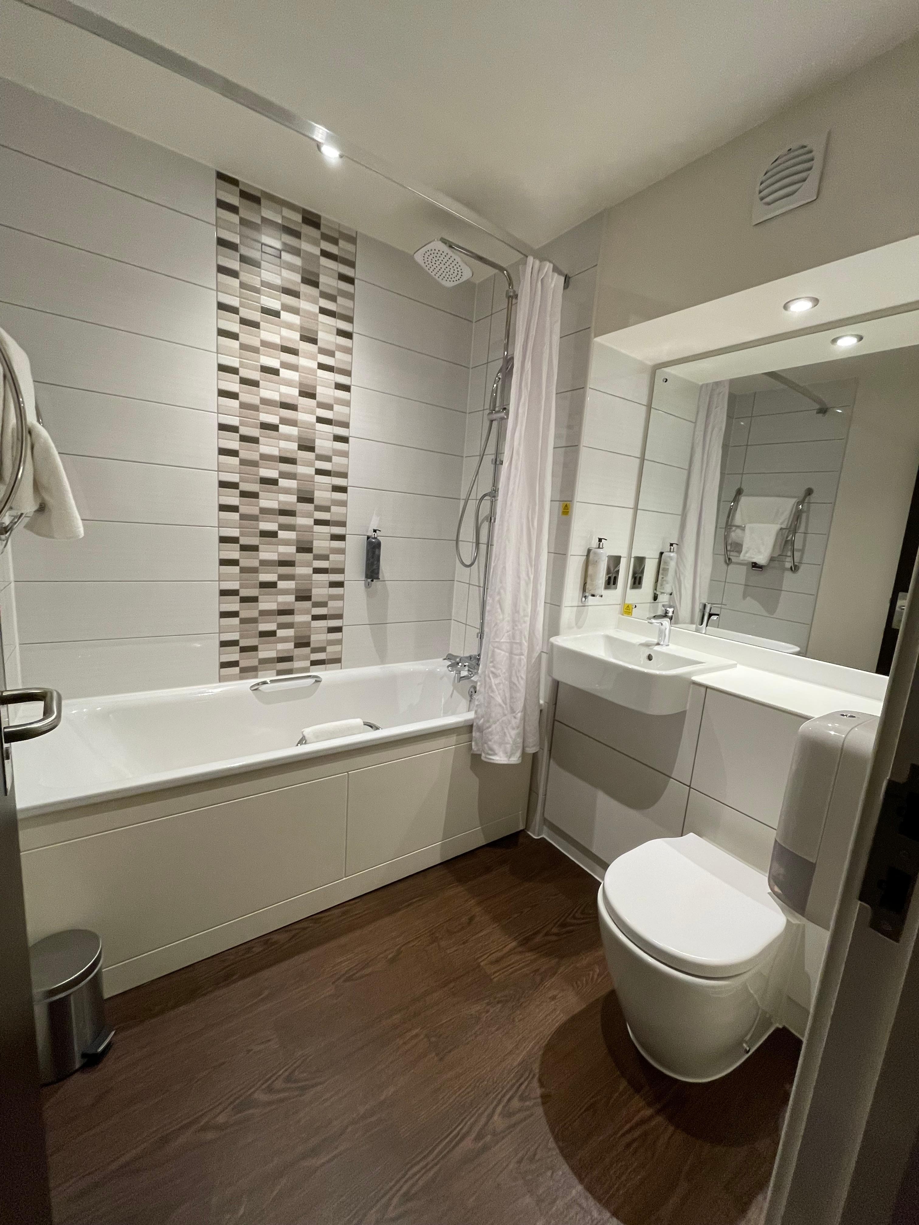 Washroom in a room set up family style - 1 "double" bed and two single beds.