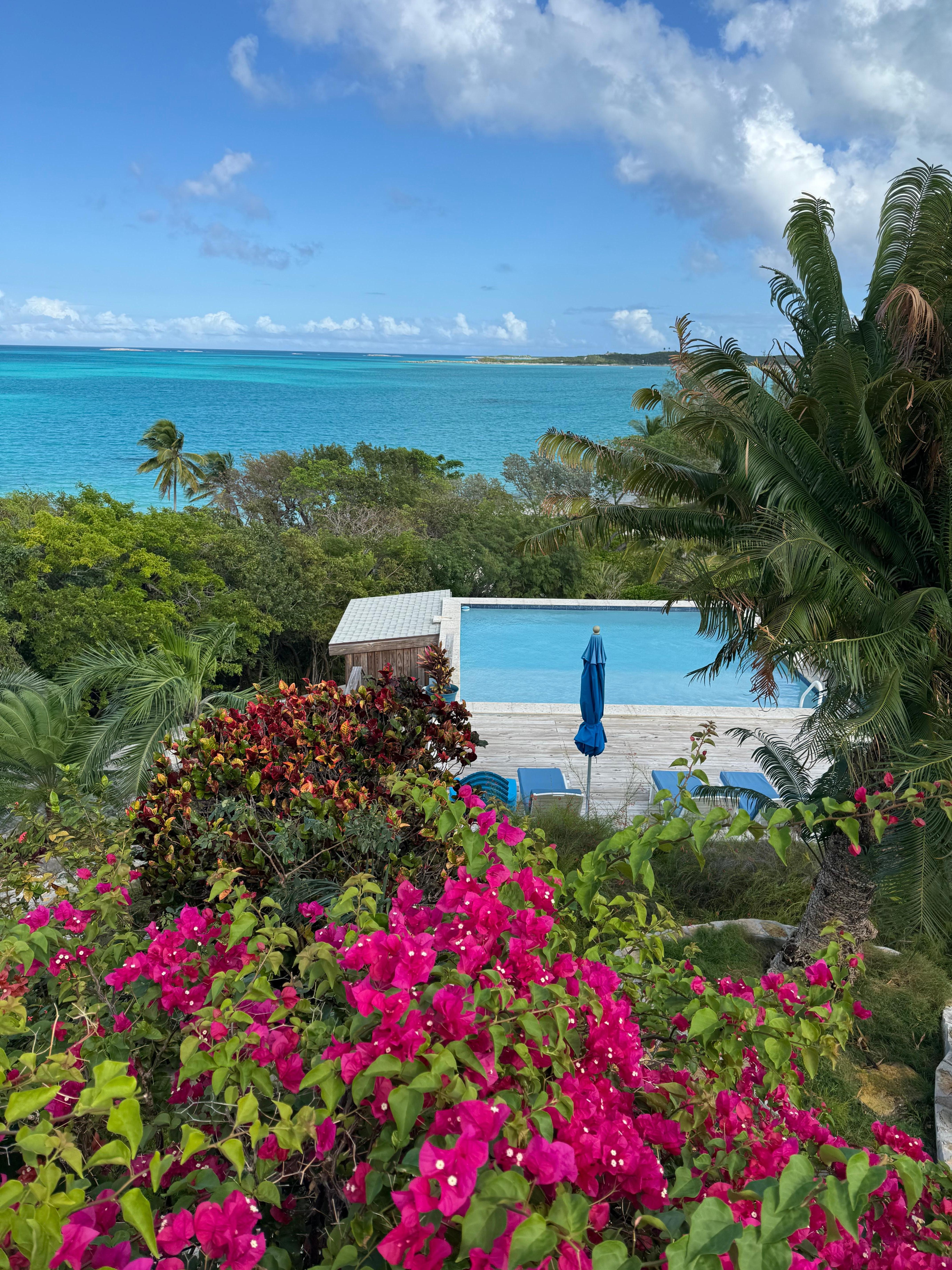View from main house over private pool down to private beach