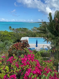 View from main house over private pool down to private beach