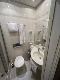 The bathroom is small in size but clean and in perfect working order. No discomfort found.