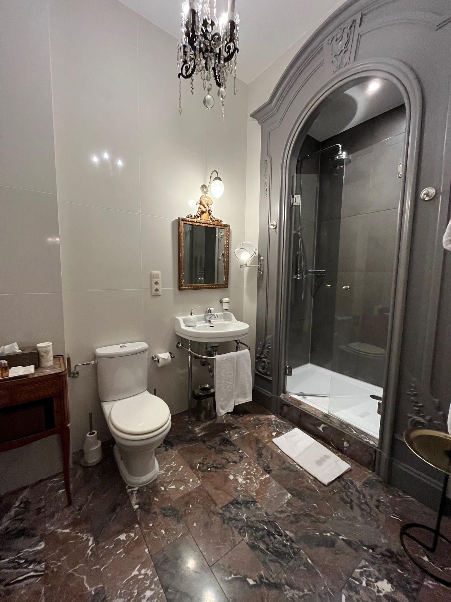 Large bathroom with large shower.  You can be 7 feet tall and have no problem. 