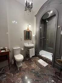 Large bathroom with large shower.  You can be 7 feet tall and have no problem.