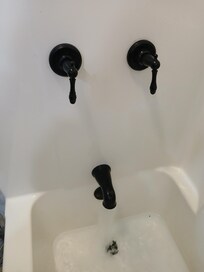 Shower handles downward and off