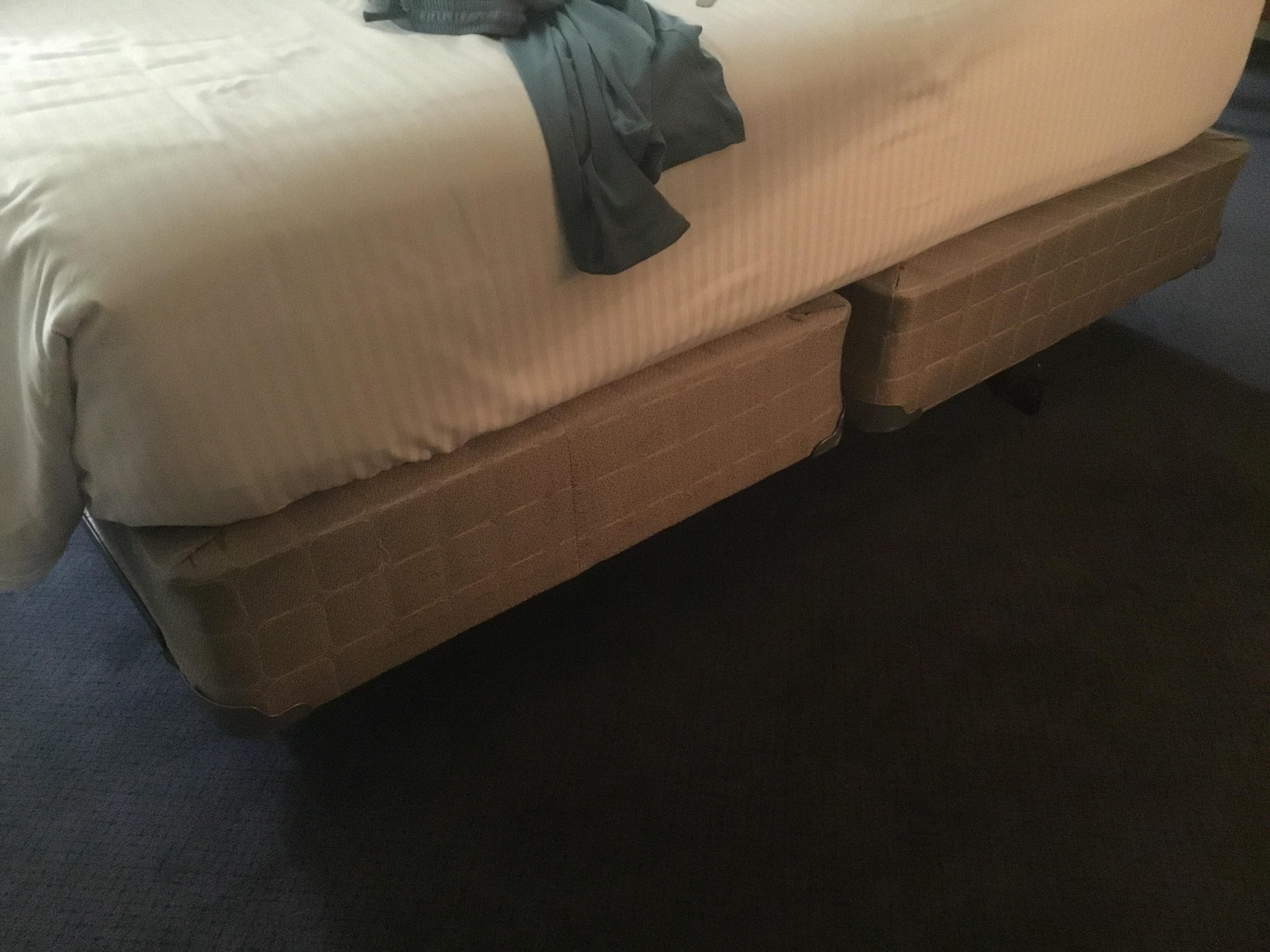 Nasty old box springs under comfy mattress. 