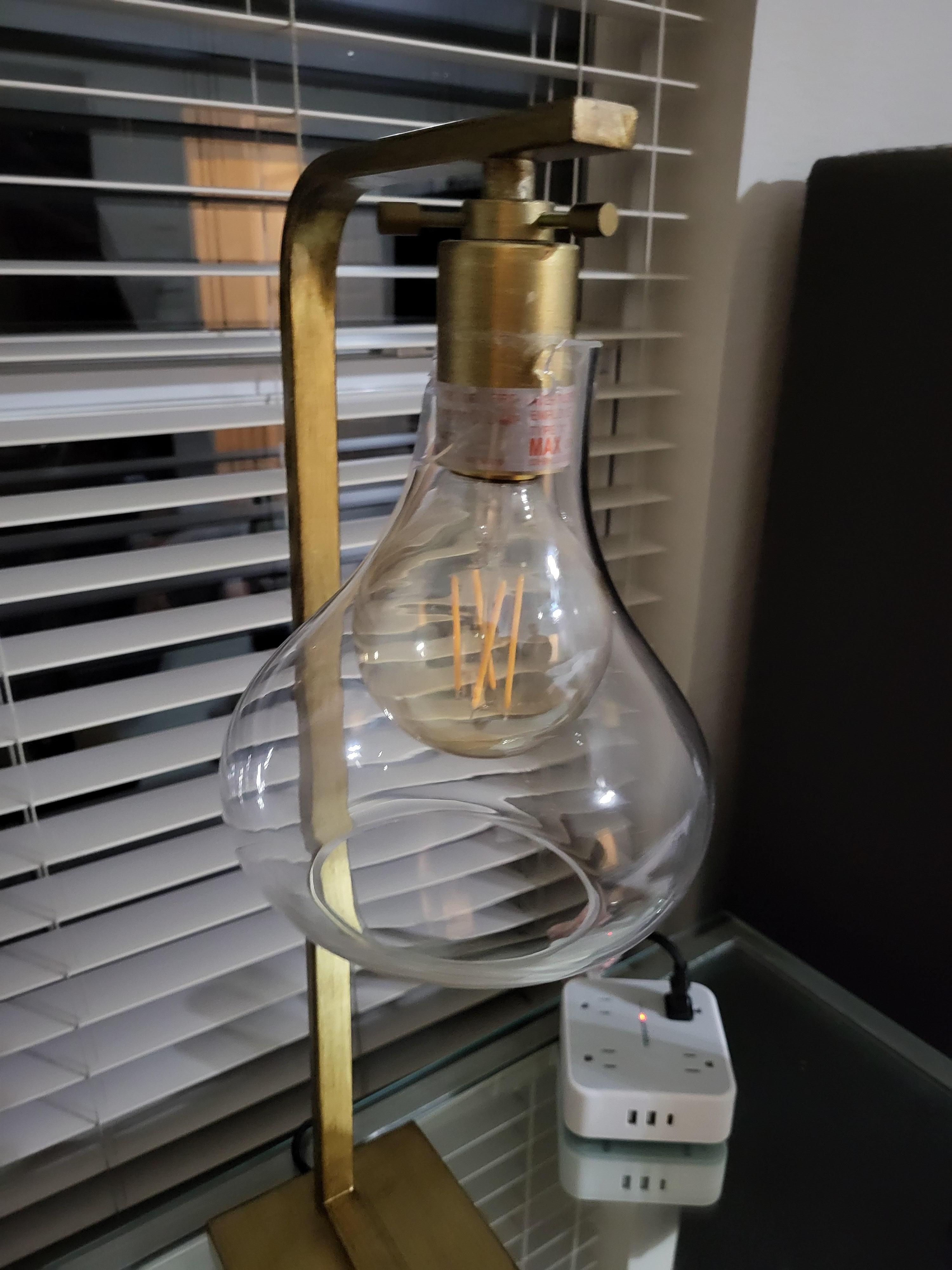 Globe was broken and barely hanging there.