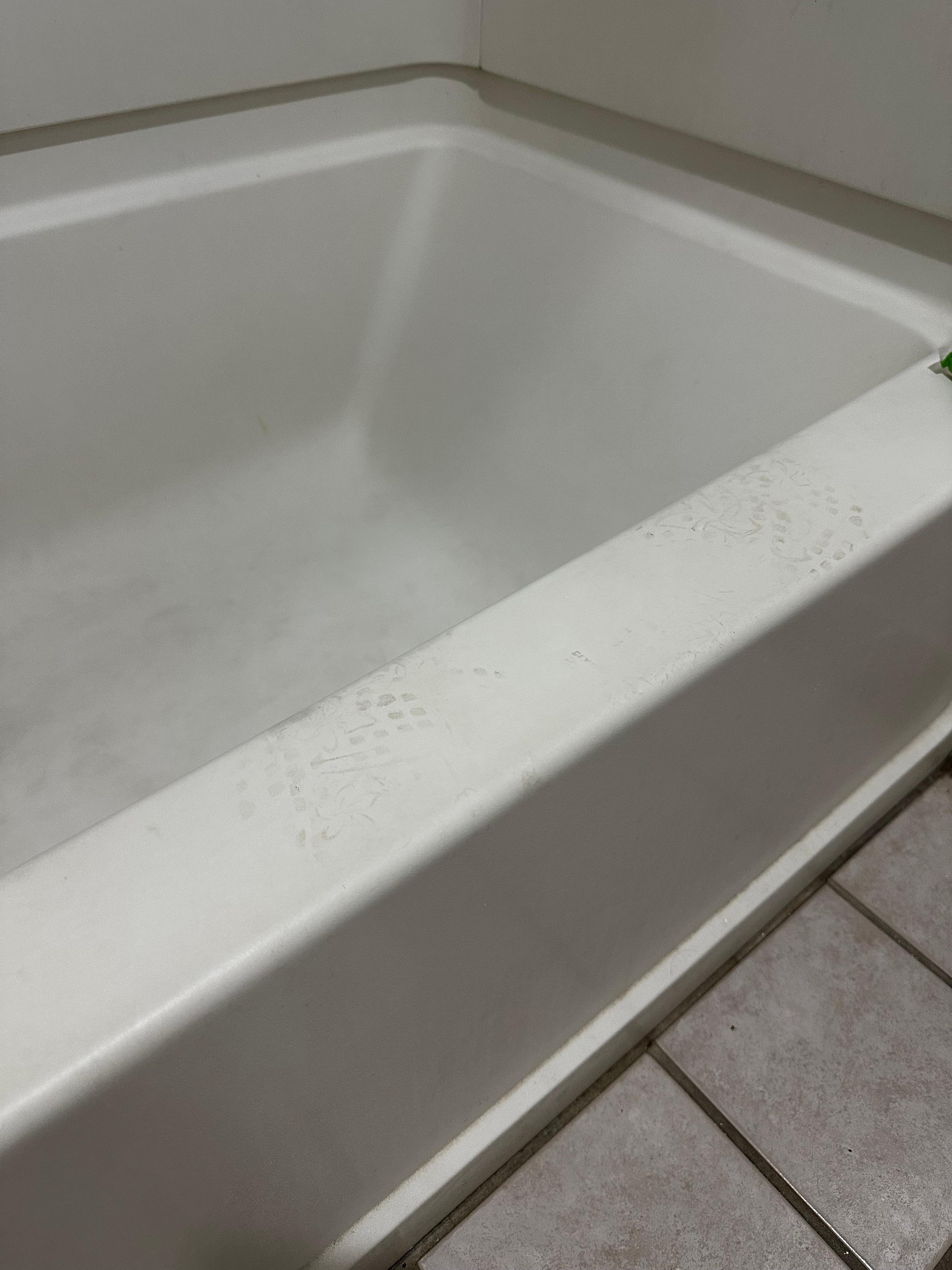 Dirty feet print on side of tub filthy inside tub
