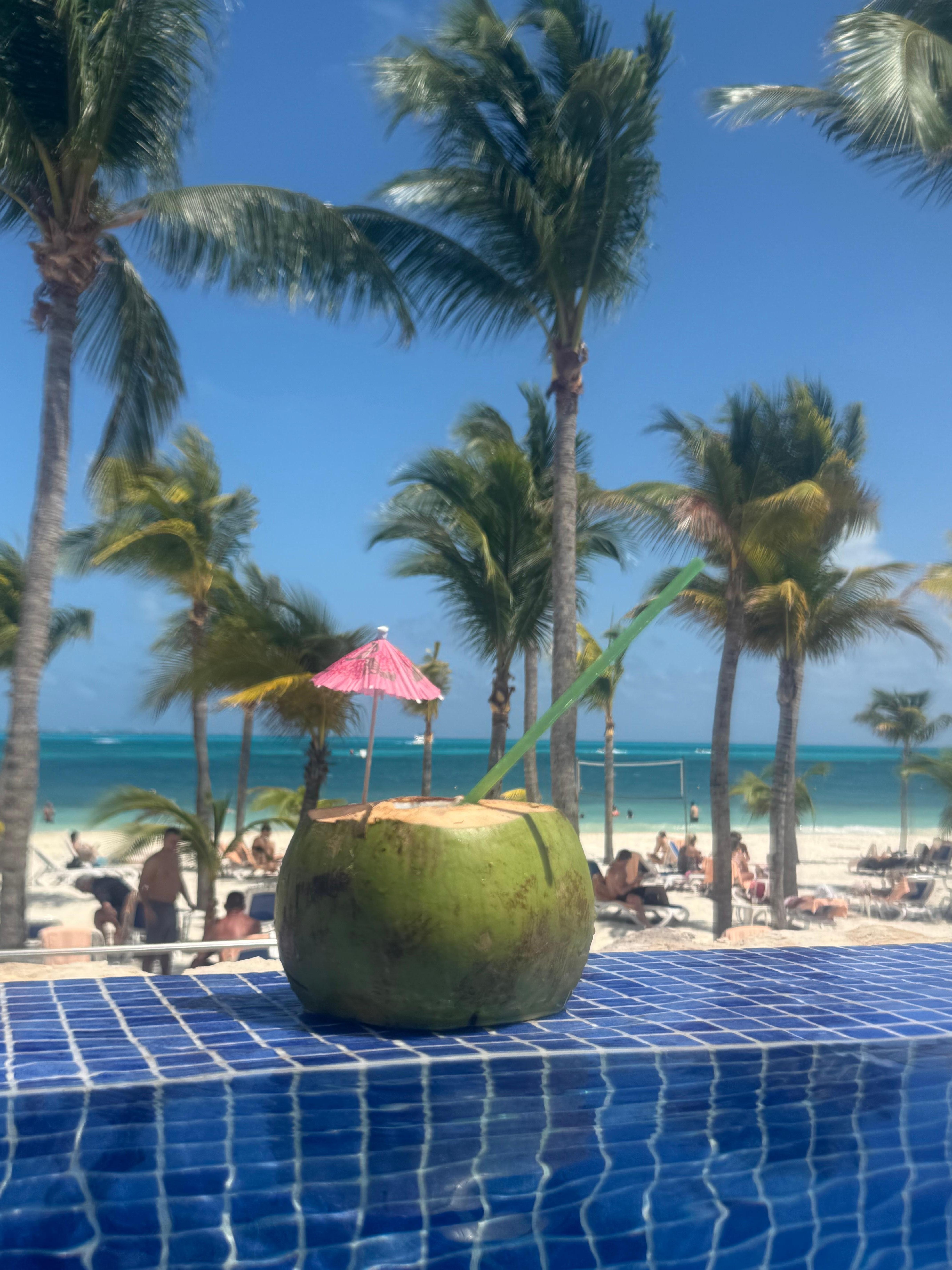 Drinking a coconut at the pool.