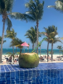 Drinking a coconut at the pool.