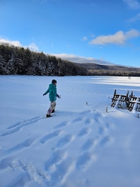 Snowshoeing on the snow covered lake