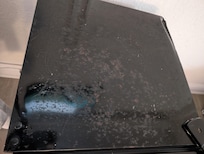 Top of the refrigerator is rusty .