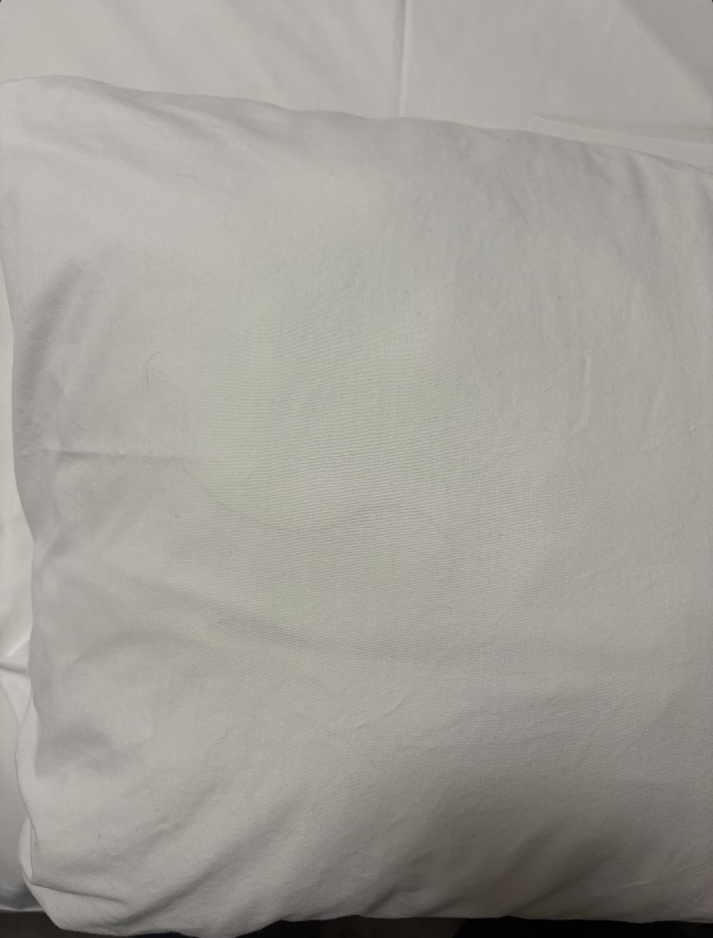 Hair inside the pillow case.