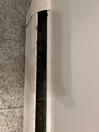 Heater in bathroom, exposed metal. Dusty, dirty, musty smells