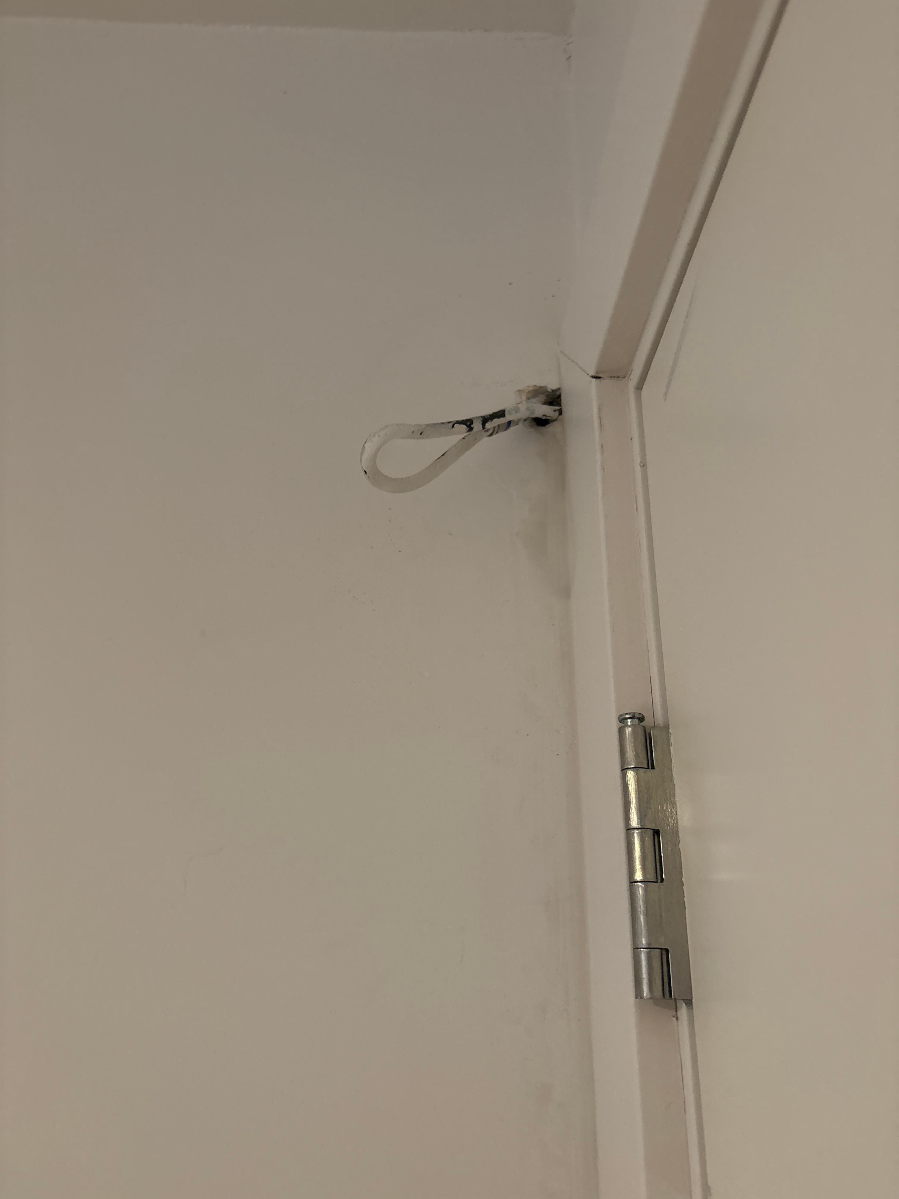 Wires hanging by door